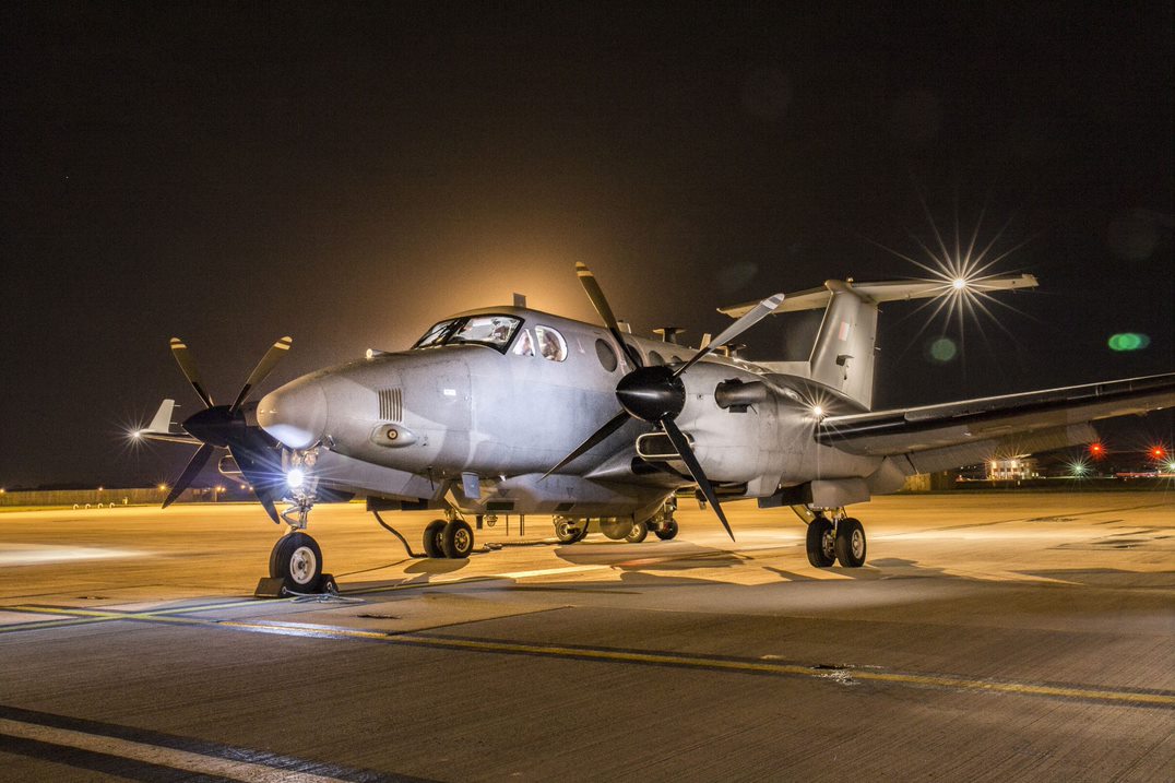 Shadow surveillance aircraft on the runaway at night. 